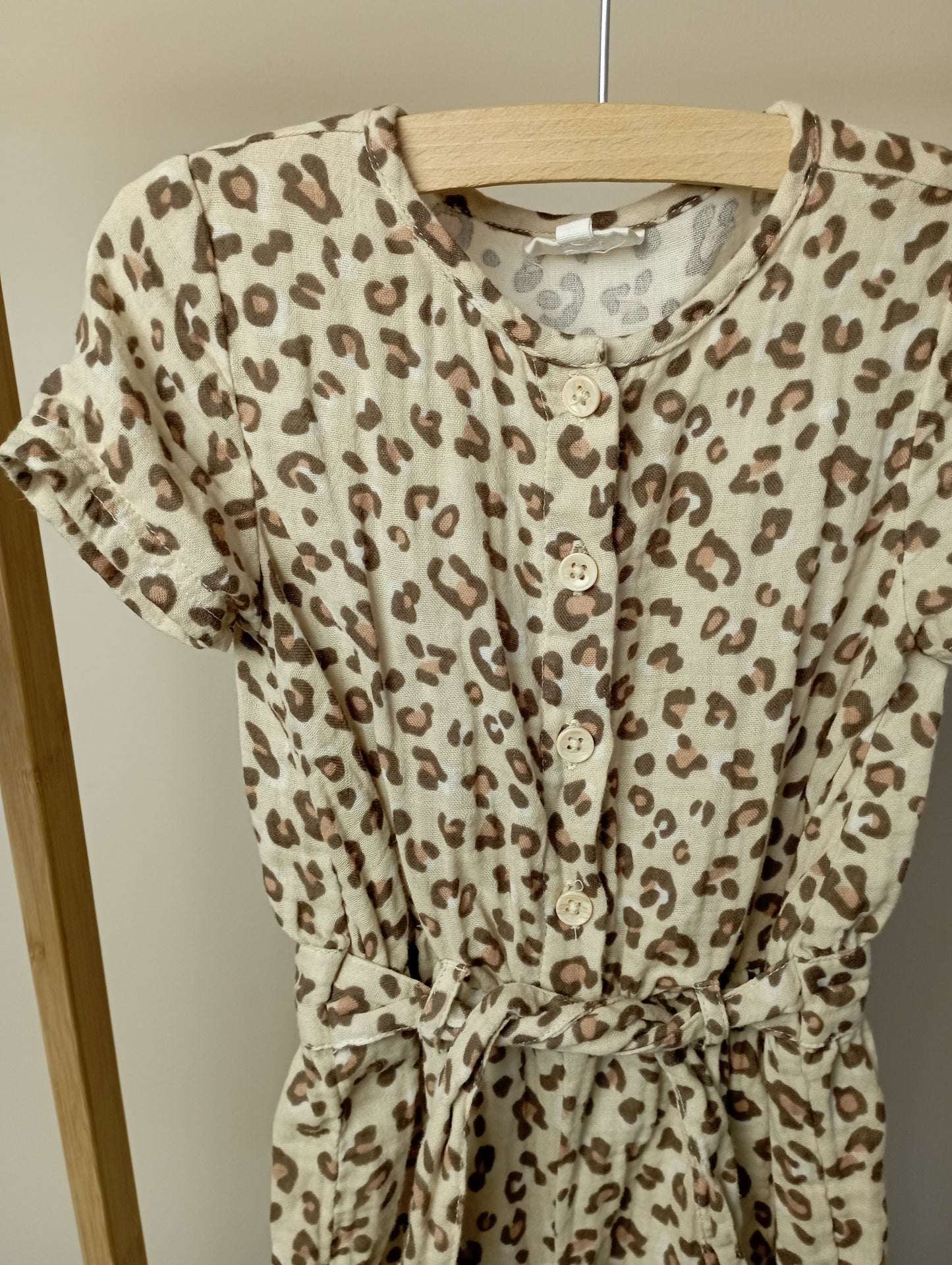 Leopard playsuit 86 Cuddles and smiles