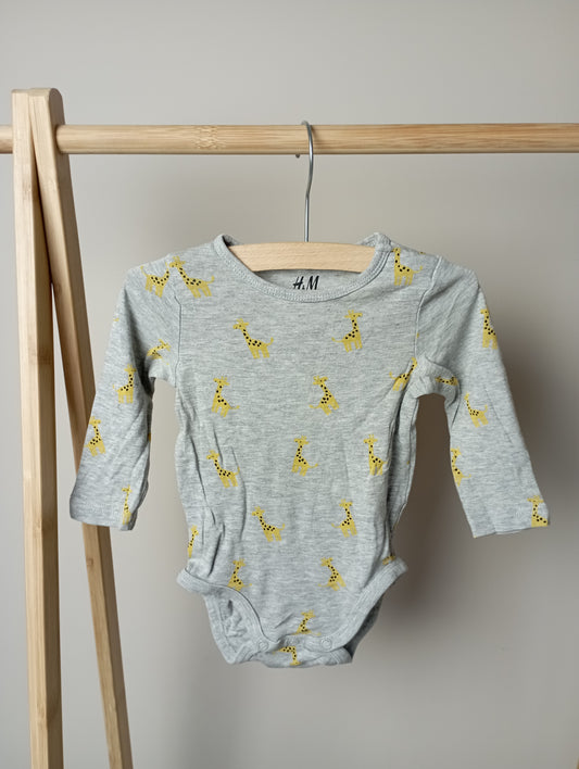 Romper met giraffen 68 H&M